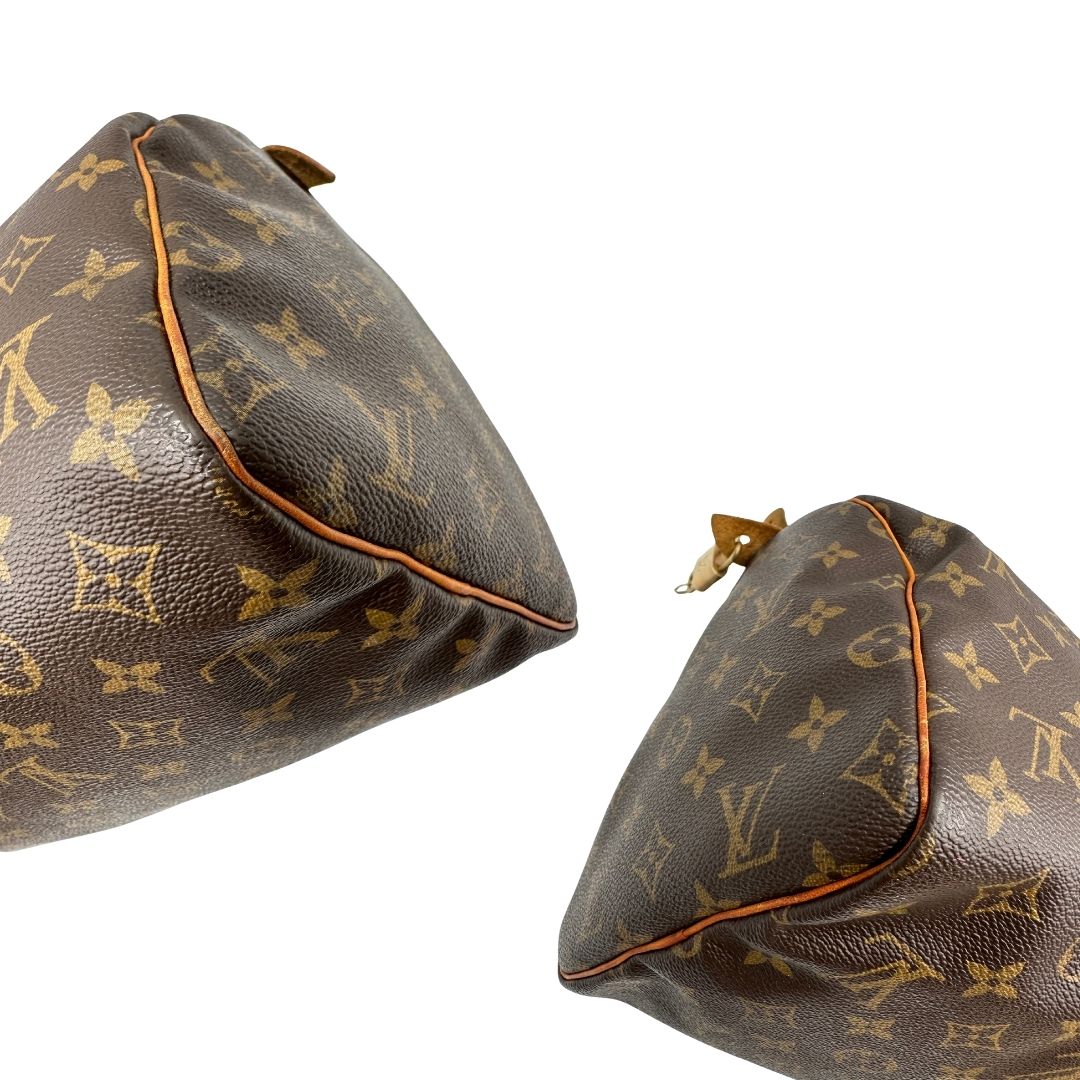 angoli Borsa Louis Vuitton in canvas marrone monogram con finiture in vacchetta naturale e parti metalliche dorate; munita di doppi manici stondati. Completa di dustbag, lucchetto e chiavi, di lusso, originale, ottime condizioni. 