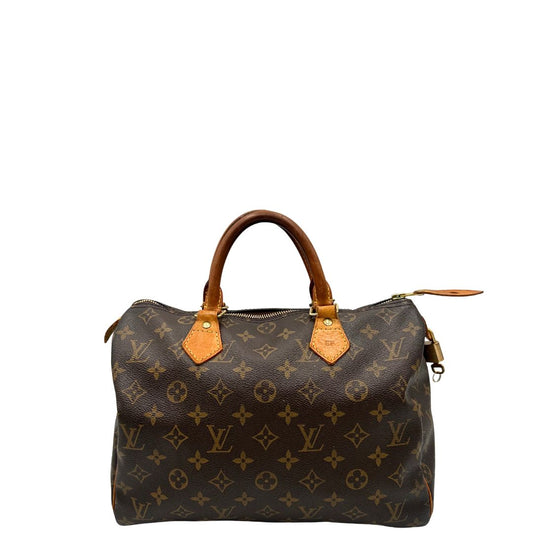 front Borsa Louis Vuitton in canvas marrone monogram con finiture in vacchetta naturale e parti metalliche dorate; munita di doppi manici stondati. Completa di dustbag, lucchetto e chiavi, di lusso, originale, ottime condizioni. 