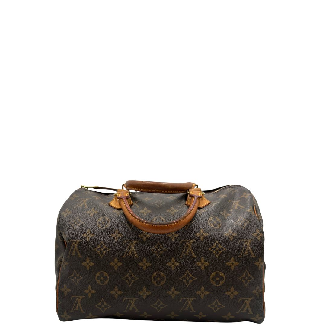 retro Borsa Louis Vuitton in canvas marrone monogram con finiture in vacchetta naturale e parti metalliche dorate; munita di doppi manici stondati. Completa di dustbag, lucchetto e chiavi, di lusso, originale, ottime condizioni. 