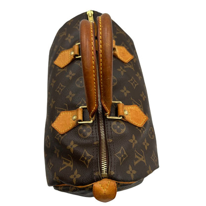 chiusura Borsa Louis Vuitton in canvas marrone monogram con finiture in vacchetta naturale e parti metalliche dorate; munita di doppi manici stondati. Completa di dustbag, lucchetto e chiavi, di lusso, originale, ottime condizioni.