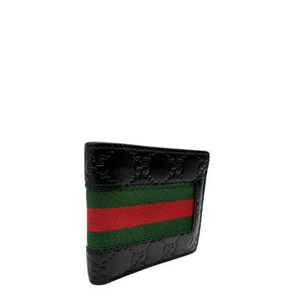 Lato destro di un Portafoglio Gucci pelle nera GG impreziosito da striscia Web verde e rossa. Completo di scatola e dustbag. Originale, usata, di lusso, in ottime condizioni.