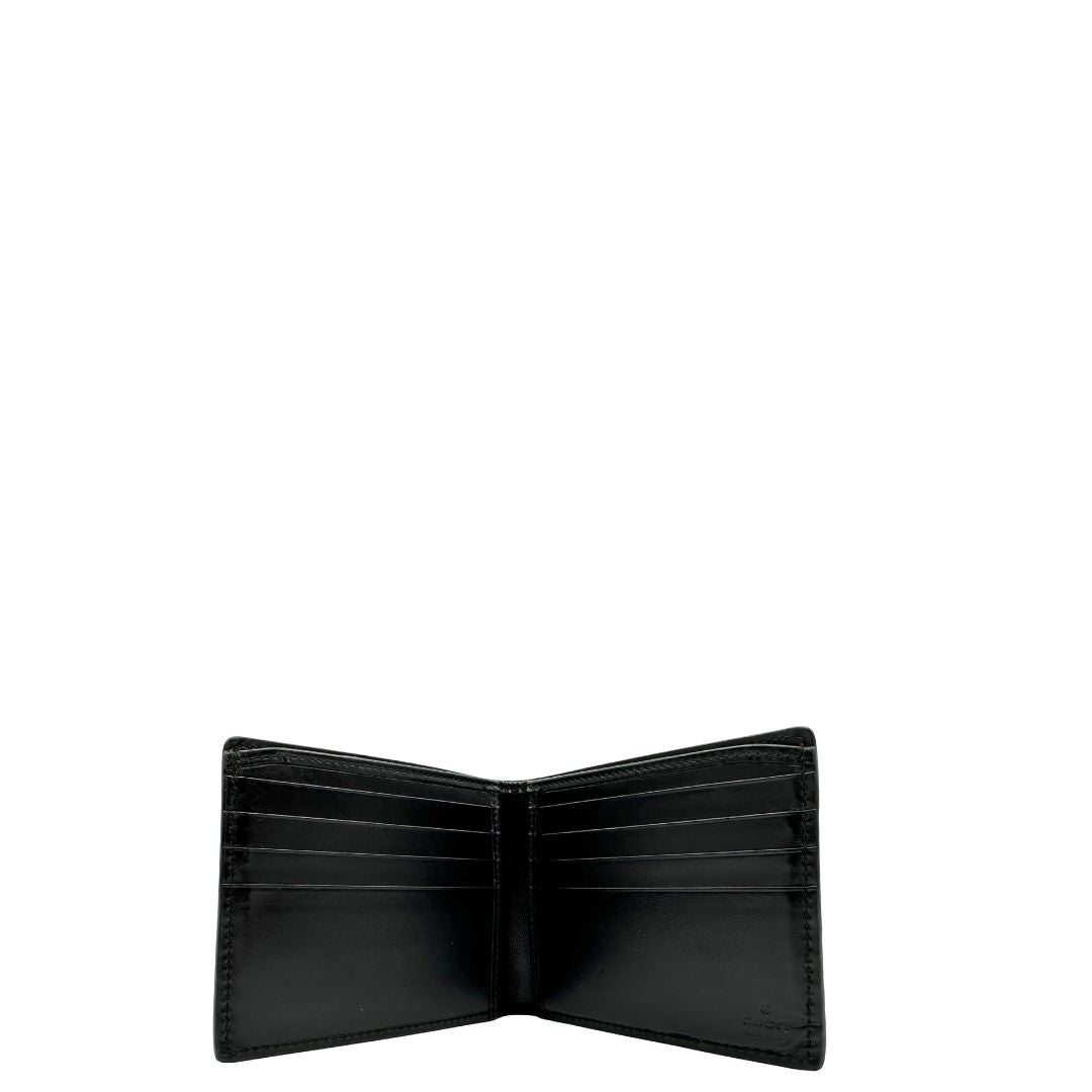 Interno di un Portafoglio Gucci pelle nera GG impreziosito da striscia Web verde e rossa. Completo di scatola e dustbag. Originale, usata, di lusso, in ottime condizioni.