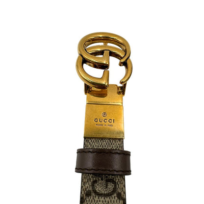  Cintura Gucci reversibile in canvas beige GG e marrone con parti metalliche dorate, di lusso, ottime condizioni, usata.