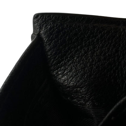 interno Portafoglio Prada in pelle martellata nera con parti metalliche dorate. Completa di scatola, di lusso, ottime , usata. 