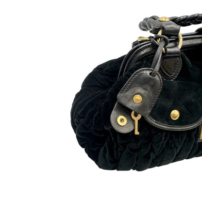 Borsa Miu Miu in velluto nero con finiture in pelle tono su tono e parti metalliche dorate; munita di doppi manici intrecciati, di lusso, originale, ottime condizioni, usata. 