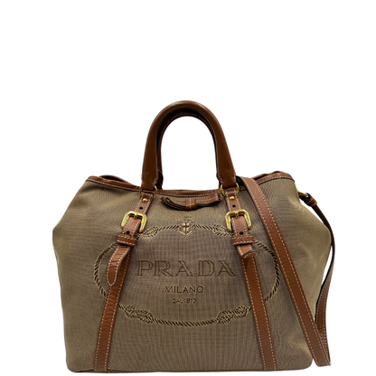 front  Borsa Prada in tessuto Jacquard, finiture in pelle marroni e parti metalliche dorate; munita di doppi manici e una tracolla amovibile e regolabile. Completa di dustbag, di lusso, originale, ottime condizioni. 