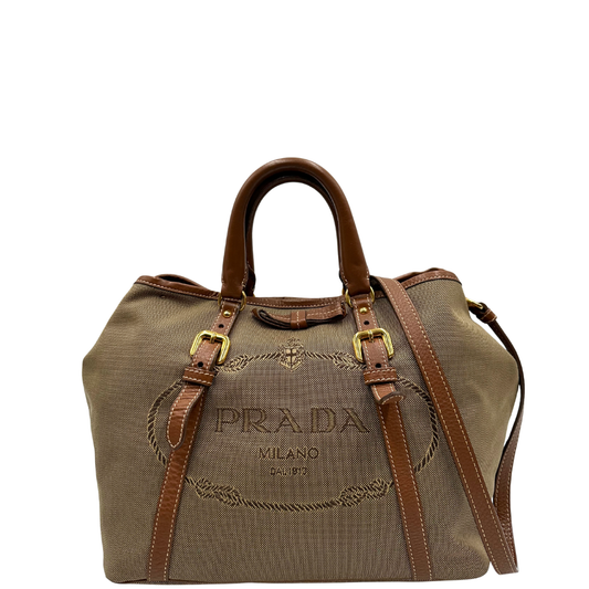 front  Borsa Prada in tessuto Jacquard, finiture in pelle marroni e parti metalliche dorate; munita di doppi manici e una tracolla amovibile e regolabile. Completa di dustbag, di lusso, originale, ottime condizioni. 