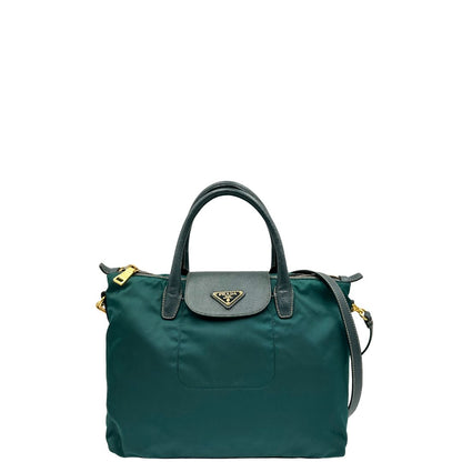 front Borsa Prada in nylon color ottanio con finiture in pelle tono su tono e parti metalliche dorate; munita di doppi manici stondati e una tracolla amovibile e regolabile. Completa di dustbag, di lusso, originale, ottime condizioni. 