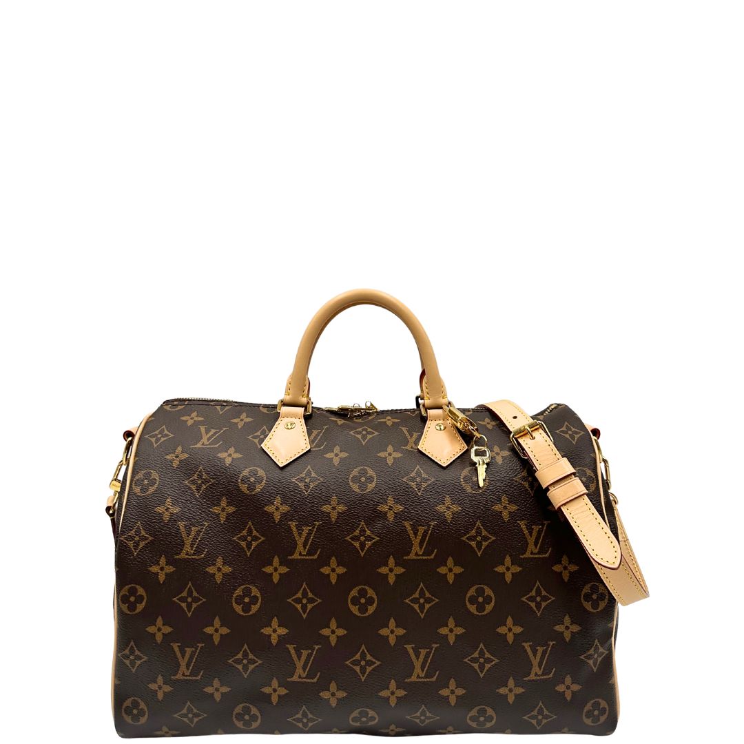 front Borsa Speedy 35 in canvas marrone monogram con finiture in vacchetta naturale e parti metalliche dorate; munita di doppi manici stondati e una tracolla amovibile e regolabile. Completa di corredo, lucchetto e chiavi, di lusso, originale, eccellenti condizioni. 