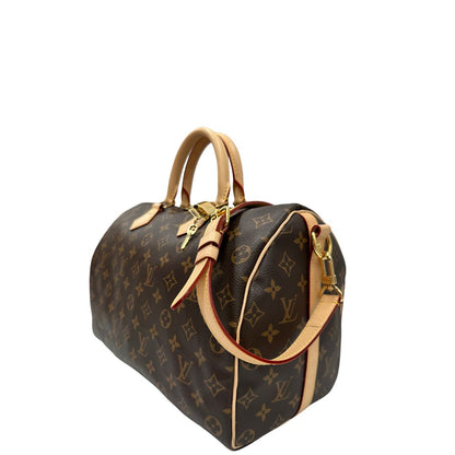 lato Borsa Speedy 35 in canvas marrone monogram con finiture in vacchetta naturale e parti metalliche dorate; munita di doppi manici stondati e una tracolla amovibile e regolabile. Completa di corredo, lucchetto e chiavi, di lusso, originale, eccellenti condizioni.