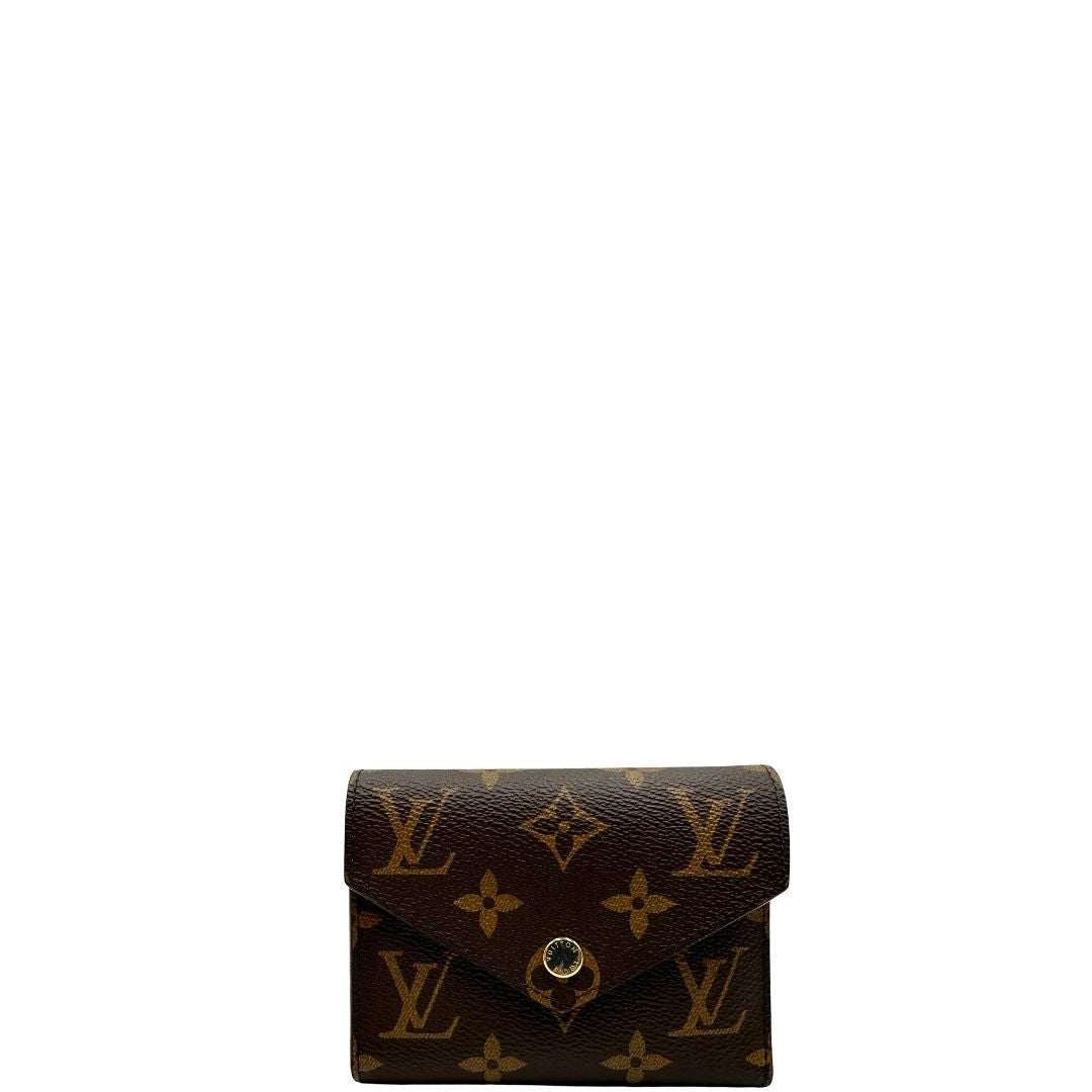 Portafoglio Louis Vuitton in canvas marrone monogram con parti metalliche dorate. Completo di corredo, di lusso, originale, eccellenti condizioni.