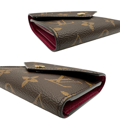 angoli Portafoglio Louis Vuitton in canvas marrone monogram con parti metalliche dorate. Completo di corredo, di lusso, originale, eccellenti condizioni. 