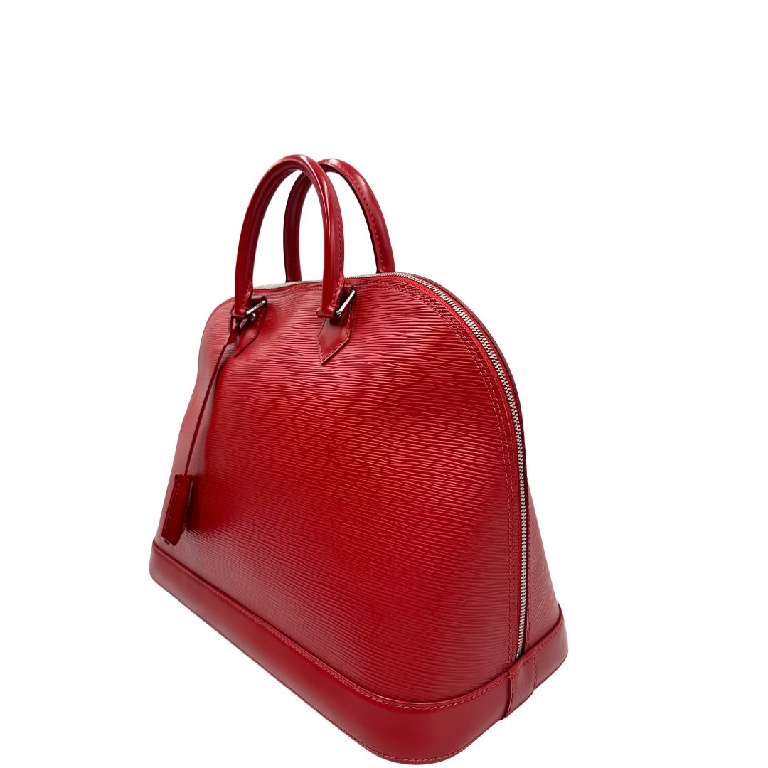 lato  Borsa Alma GM Louis Vuitton in pelle Epi rossa con parti metalliche argentate, munita di due manici stondati. Completa di lucchetto e chiavi, di lusso, usata, originale. 