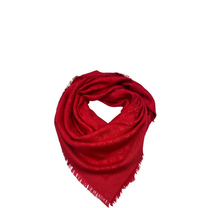 Sciarpa Louis Vuitton rossa monogram con bordi sfrangiati in 55% lana e 45% seta. Completa di scatola, di lusso, originale, ottime condizoni.