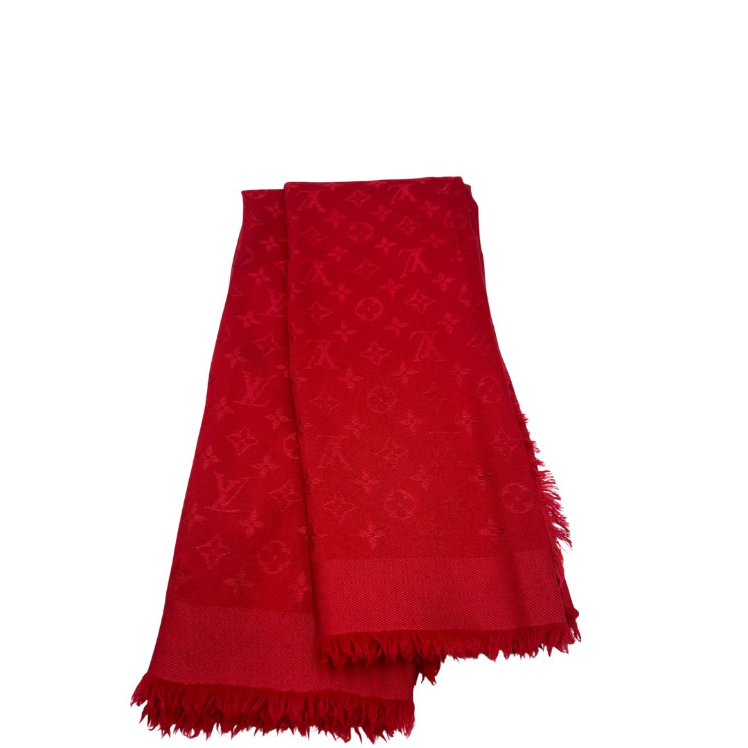 Sciarpa Louis Vuitton rossa monogram con bordi sfrangiati in 55% lana e 45% seta. Completa di scatola, di lusso, originale, ottime condizoni.