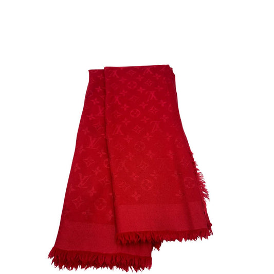 Sciarpa Louis Vuitton rossa monogram con bordi sfrangiati in 55% lana e 45% seta. Completa di scatola, di lusso, originale, ottime condizoni.