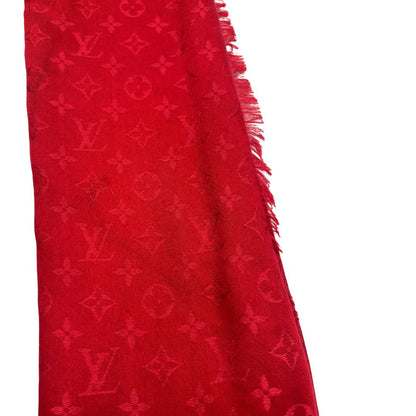 Sciarpa Louis Vuitton rossa monogram con bordi sfrangiati in 55% lana e 45% seta. Completa di scatola, di lusso, originale, ottime condizoni.