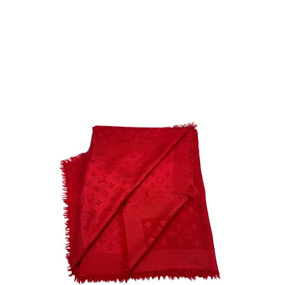 Sciarpa Louis Vuitton rossa monogram con bordi sfrangiati in 55% lana e 45% seta. Completa di scatola, di lusso, originale, ottime condizoni.