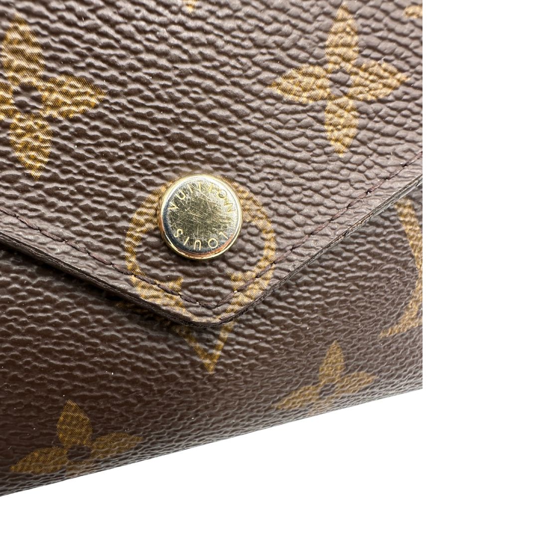 Portafoglio Louis Vuitton in canvas marrone monogram con parti metalliche dorate. Completo di scatola, di lusso, originale, ottime condizioni.