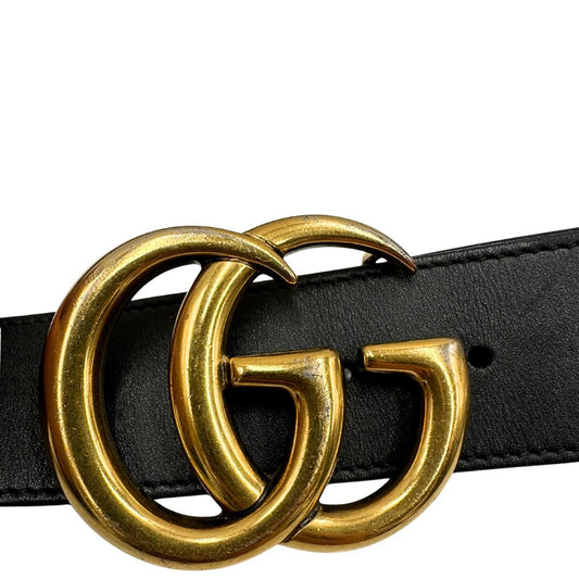 Cintura Gucci in pelle nera con parti metalliche dorate. Completa di dustbag, di lusso, originale, buone condizioni, usata