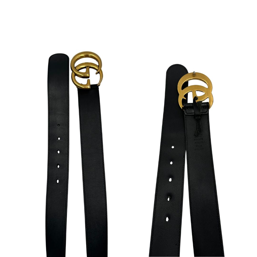 Cintura Gucci in pelle nera con parti metalliche dorate. Completa di dustbag, di lusso, originale, buone condizioni, usata