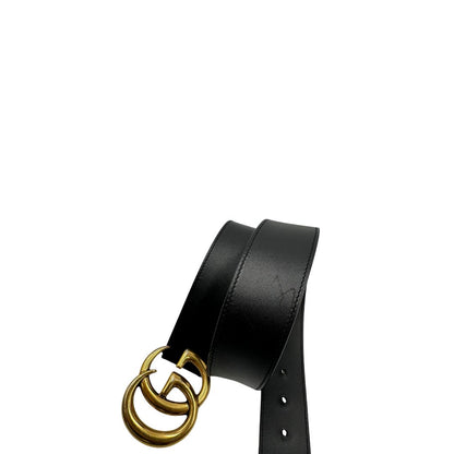 Cintura Gucci in pelle nera con parti metalliche dorate. Completa di dustbag, di lusso, originale, buone condizioni, usata