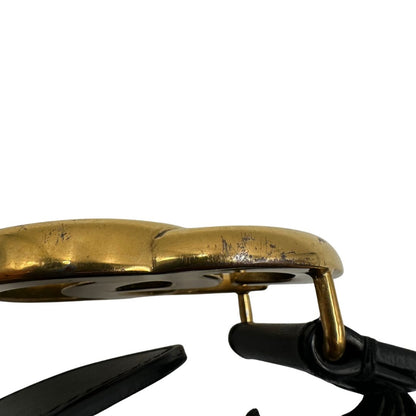 Cintura Gucci in pelle nera con parti metalliche dorate. Completa di dustbag, di lusso, originale, buone condizioni, usata