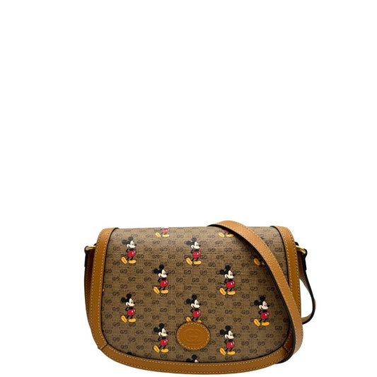 front Borsa Gucci  in canvas GG mini marrone con finiture in pelle tono su tono e parti metalliche dorate; stampa di topolino sul canvas, munita di una tracolla regolabile. Completa di dustbag, di lusso, eccellenti condizioni, usata. 