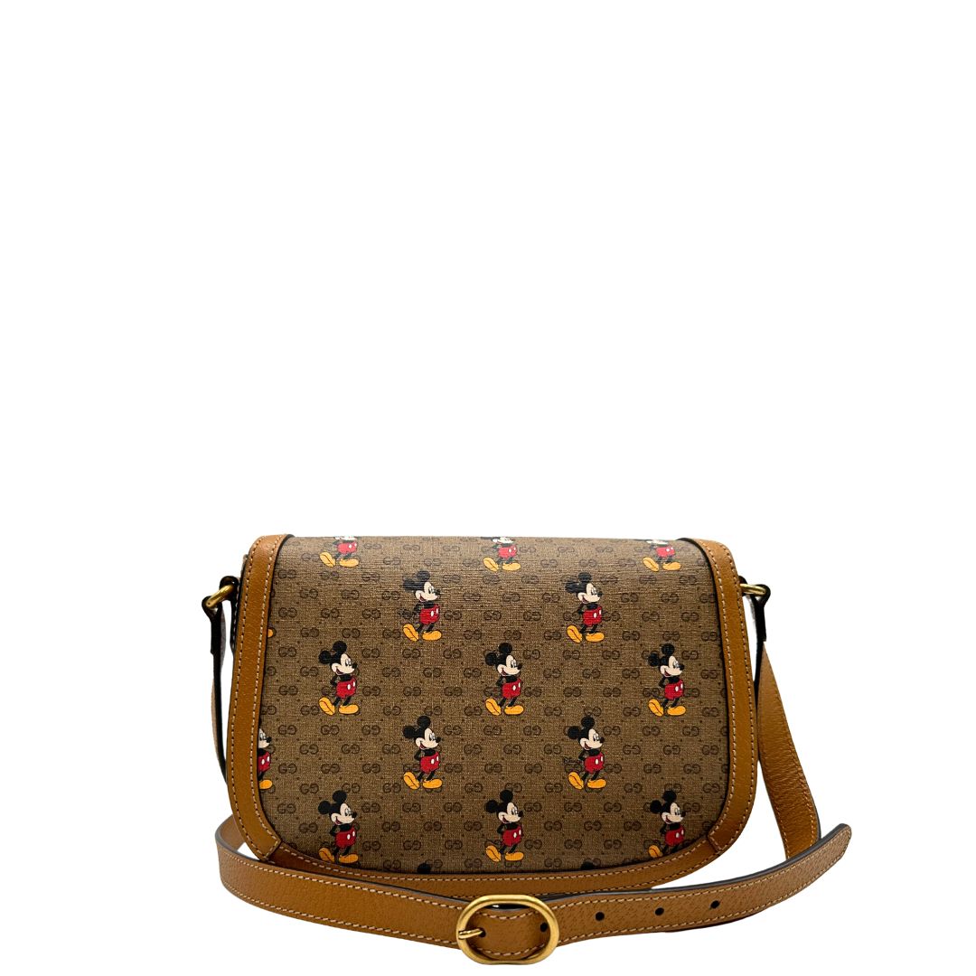 retro Borsa Gucci  in canvas GG mini marrone con finiture in pelle tono su tono e parti metalliche dorate; stampa di topolino sul canvas, munita di una tracolla regolabile. Completa di dustbag, di lusso, eccellenti condizioni, usata. 