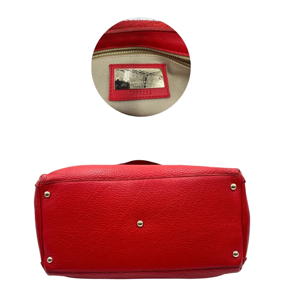 base Borsa Zanellato in pelle martellata rossa con parti metalliche dorate; munita di un manico singolo e una tracolla amovibile e regolabile. Completa di dustbag, di lusso, originale, ottime condizioni, usata. 