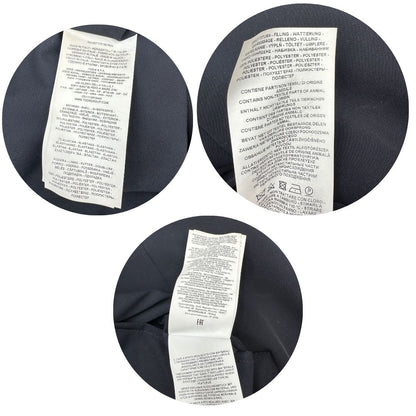 Etichette di un giubbino Fay in 93% poliestere e 7% elastan blu navy, con iconici ganci Fay per la chiusura.