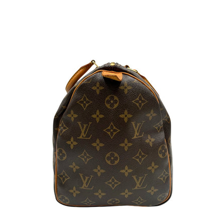 lato Borsa Louis Vuitton in canvas monogram marrone con parti metalliche dorate; munita di doppi manici stondati, da portare a mano. Completa di dustbag, lucchetto e chiavi, di lusso, usato, ottime condizioni.