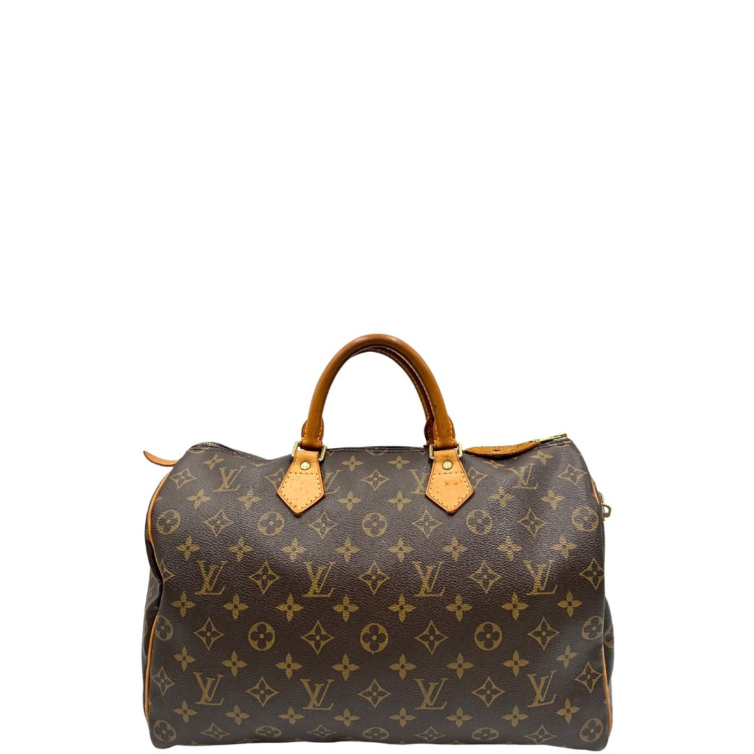 front Borsa Louis Vuitton in canvas monogram marrone con parti metalliche dorate; munita di doppi manici stondati, da portare a mano. Completa di dustbag, lucchetto e chiavi, di lusso, usato, ottime condizioni.