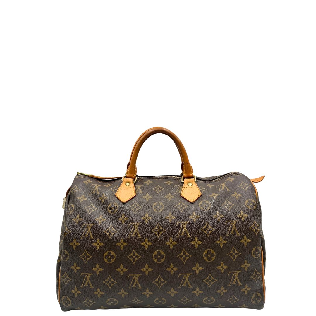 retro Borsa Louis Vuitton in canvas monogram marrone con parti metalliche dorate; munita di doppi manici stondati, da portare a mano. Completa di dustbag, lucchetto e chiavi, di lusso, usato, ottime condizioni. 