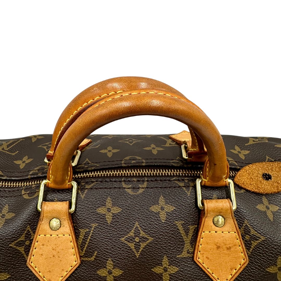 manici  Borsa Louis Vuitton in canvas monogram marrone con parti metalliche dorate; munita di doppi manici stondati, da portare a mano. Completa di dustbag, lucchetto e chiavi, di lusso, usato, ottime condizioni.