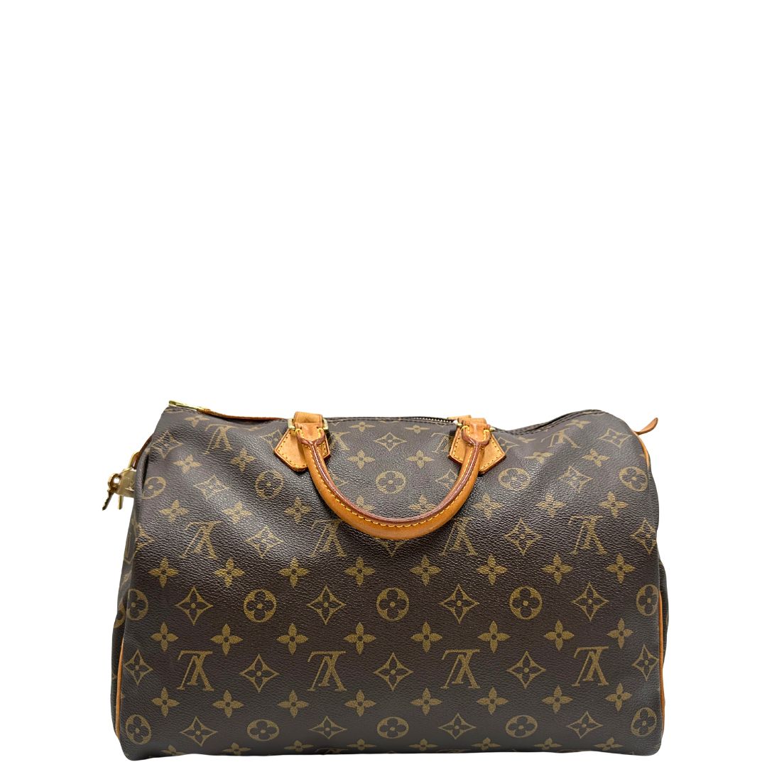 retro Borsa Louis Vuitton in canvas monogram marrone con parti metalliche dorate; munita di doppi manici stondati, da portare a mano. Completa di dustbag, lucchetto e chiavi, di lusso, usato, ottime condizioni. 