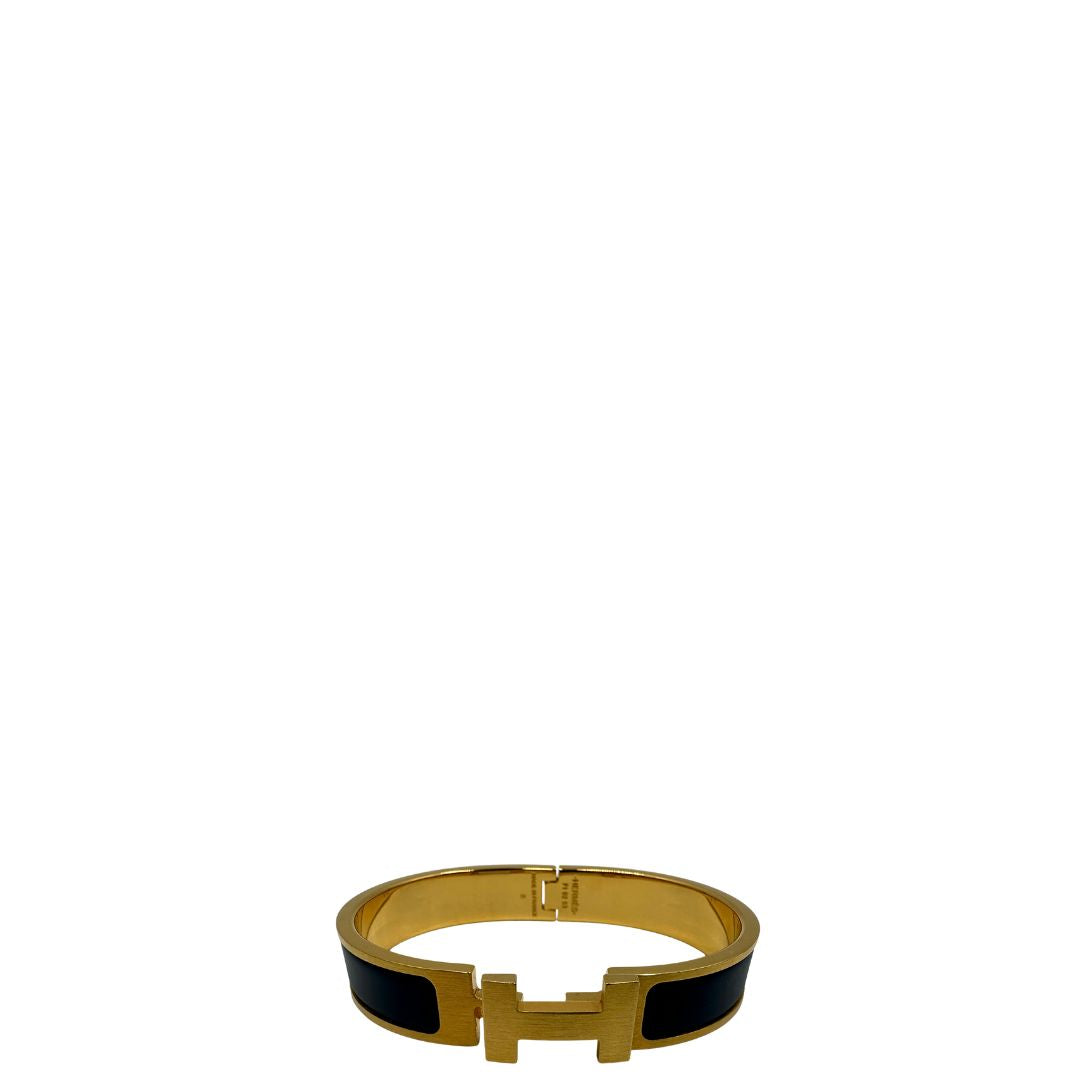 Bracciale Hèrmes in metallo dorato con smalto opaco blu. Completo di corredo, di lusso, originale, ottime condizioni.