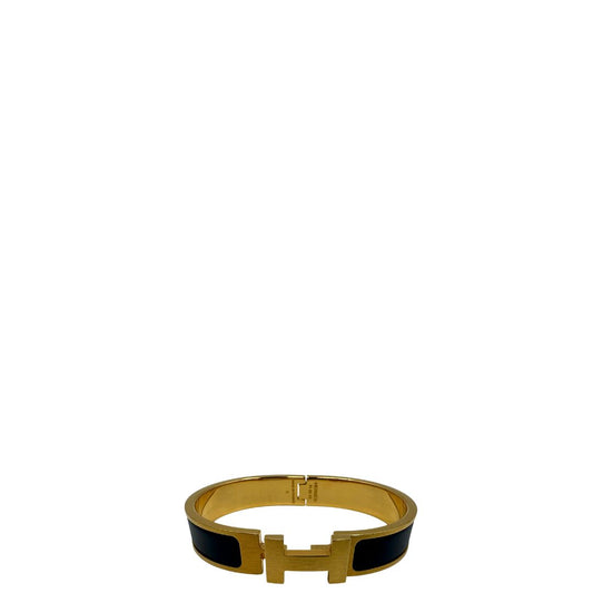 Bracciale Hèrmes in metallo dorato con smalto opaco blu. Completo di corredo, di lusso, originale, ottime condizioni.