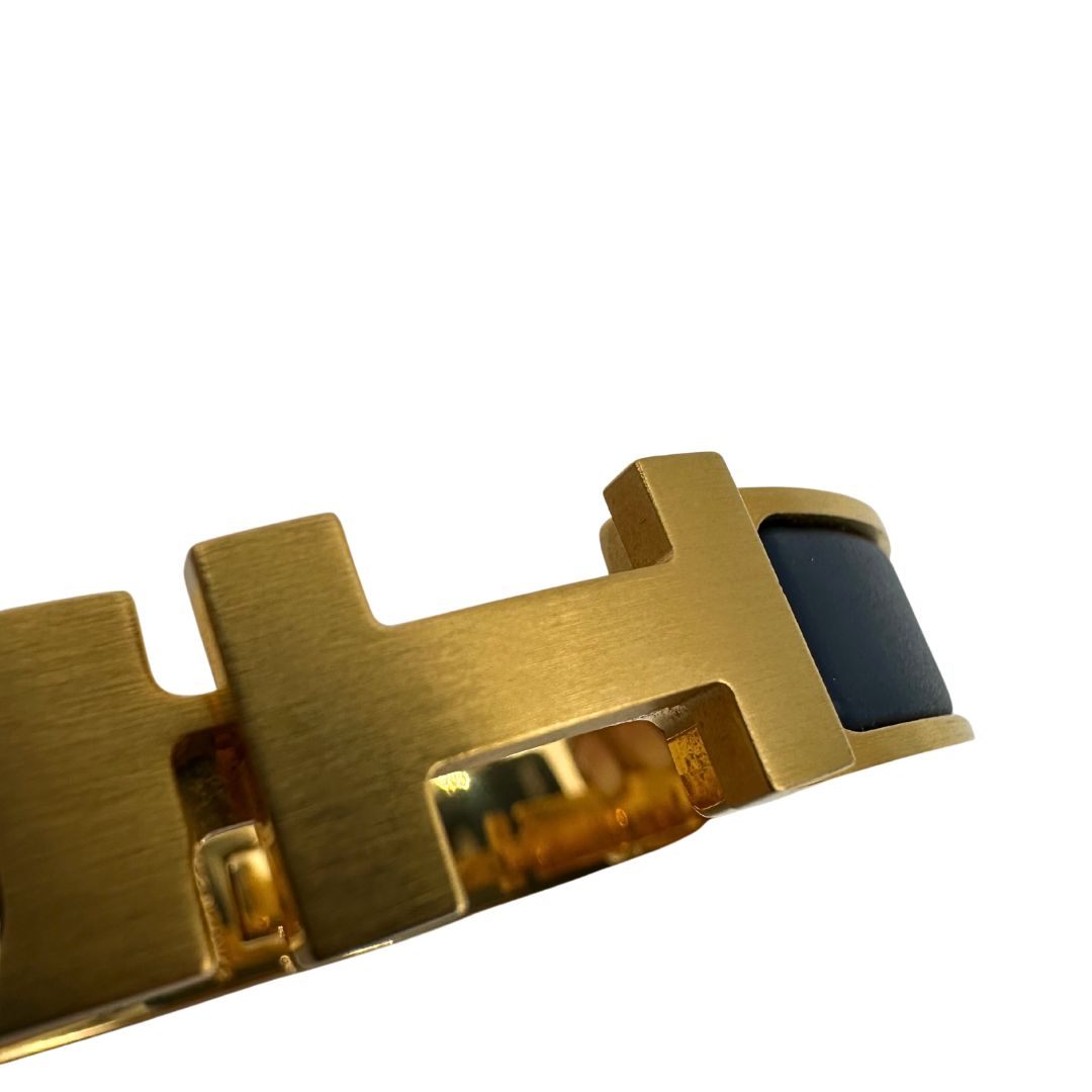 Bracciale Hèrmes in metallo dorato con smalto opaco blu. Completo di corredo, di lusso, originale, ottime condizioni.