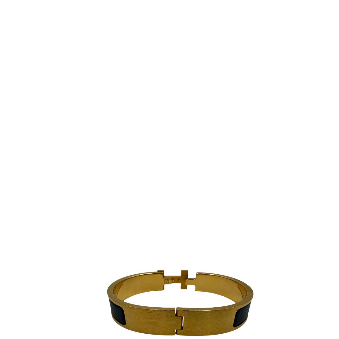 Bracciale Hèrmes in metallo dorato con smalto opaco blu. Completo di corredo, di lusso, originale, ottime condizioni.