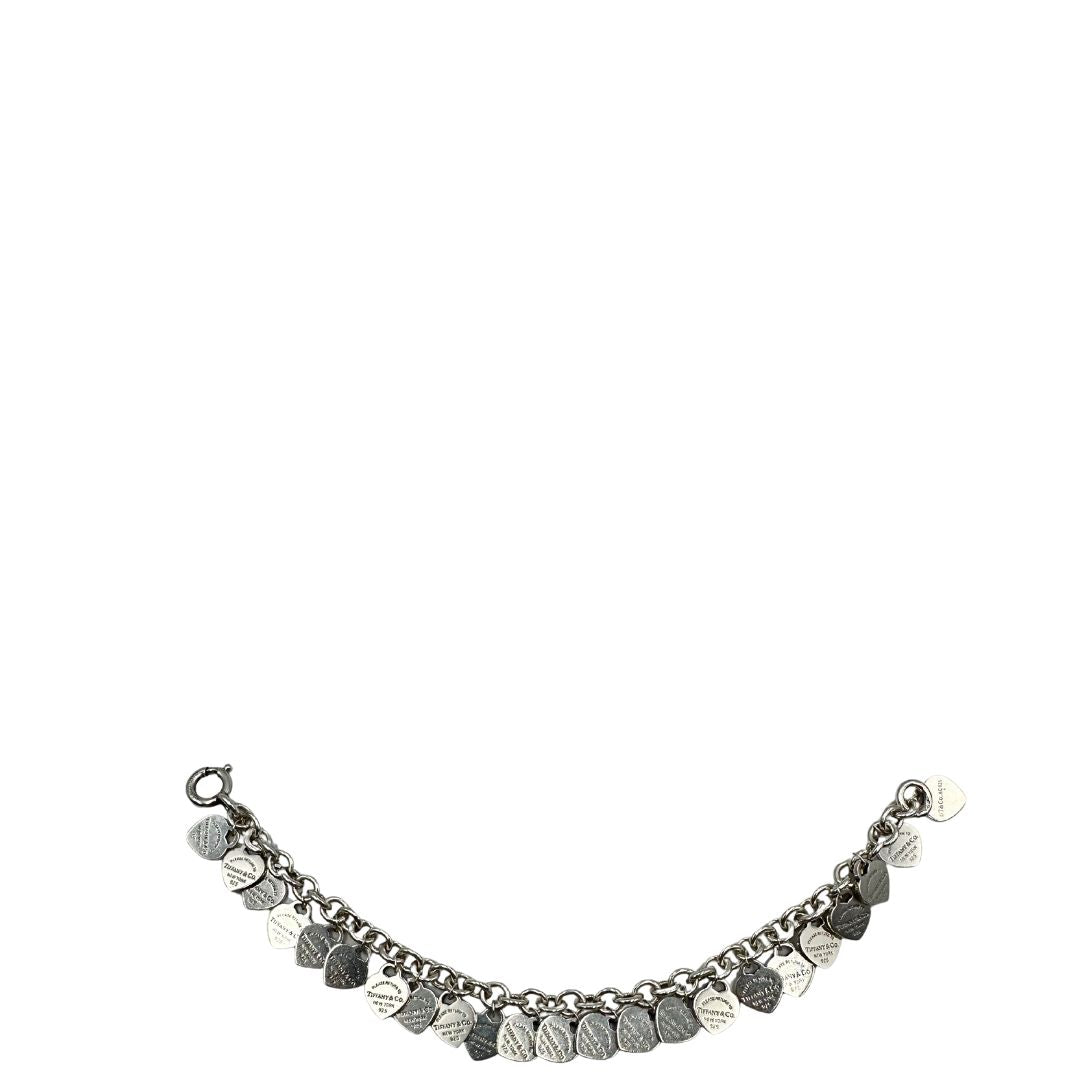 Bracciale Multi-Heart Tiffany&Co. in argento 925 con pendenti con iconici cuori. Completo di scatola e sacchetto antipolvere, di lusso, originale, ottime condizioni.