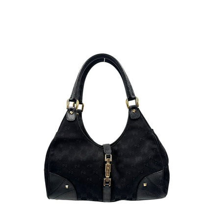 front Borsa Gucci in tessuto GG nero con finiture in pelle tono su tono e parti metalliche dorate; munita di doppi manici stondati. Completa di dustbag, di lusso, originale, ottime condizioni. 