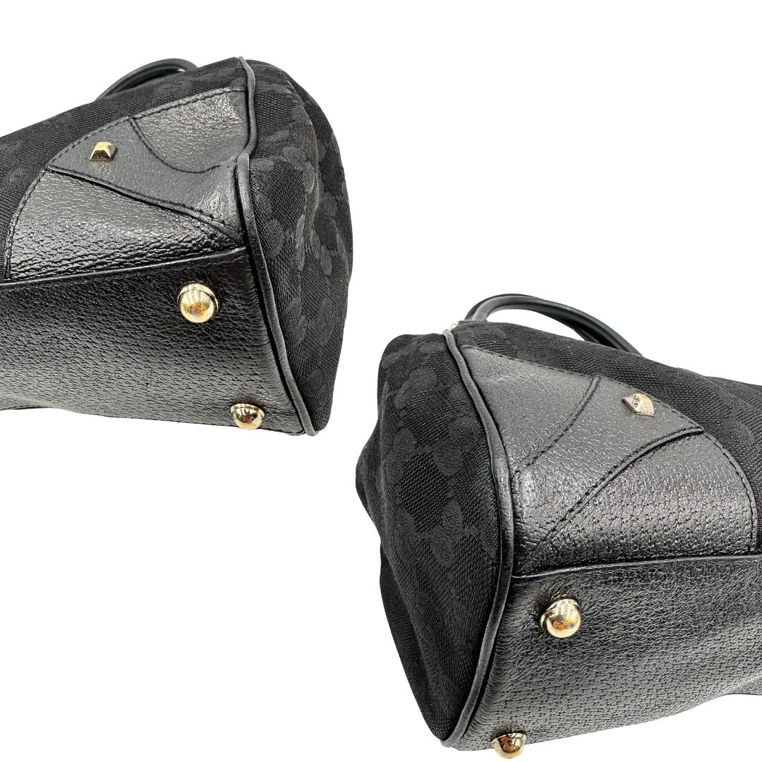 angoli Borsa Gucci in tessuto GG nero con finiture in pelle tono su tono e parti metalliche dorate; munita di doppi manici stondati. Completa di dustbag, di lusso, originale, ottime condizioni. 