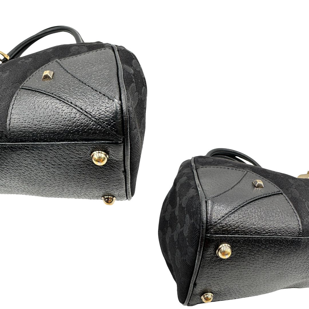 Angoli Borsa Gucci in tessuto GG nero con finiture in pelle tono su tono e parti metalliche dorate; munita di doppi manici stondati. Completa di dustbag, di lusso, originale, ottime condizioni. 