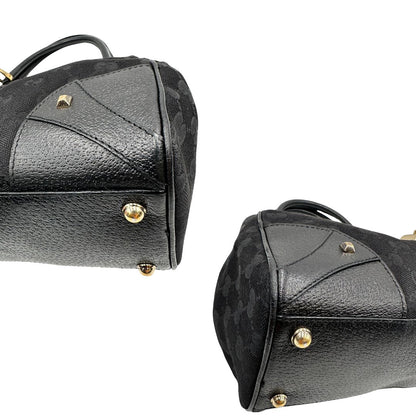 Angoli Borsa Gucci in tessuto GG nero con finiture in pelle tono su tono e parti metalliche dorate; munita di doppi manici stondati. Completa di dustbag, di lusso, originale, ottime condizioni. 