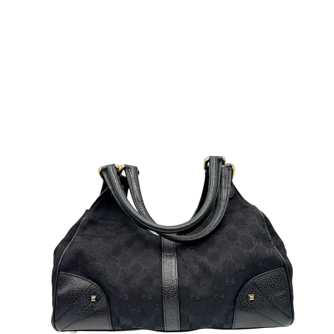 retro Borsa Gucci in tessuto GG nero con finiture in pelle tono su tono e parti metalliche dorate; munita di doppi manici stondati. Completa di dustbag, di lusso, originale, ottime condizioni. 