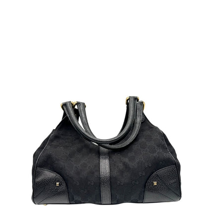 retro Borsa Gucci in tessuto GG nero con finiture in pelle tono su tono e parti metalliche dorate; munita di doppi manici stondati. Completa di dustbag, di lusso, originale, ottime condizioni. 