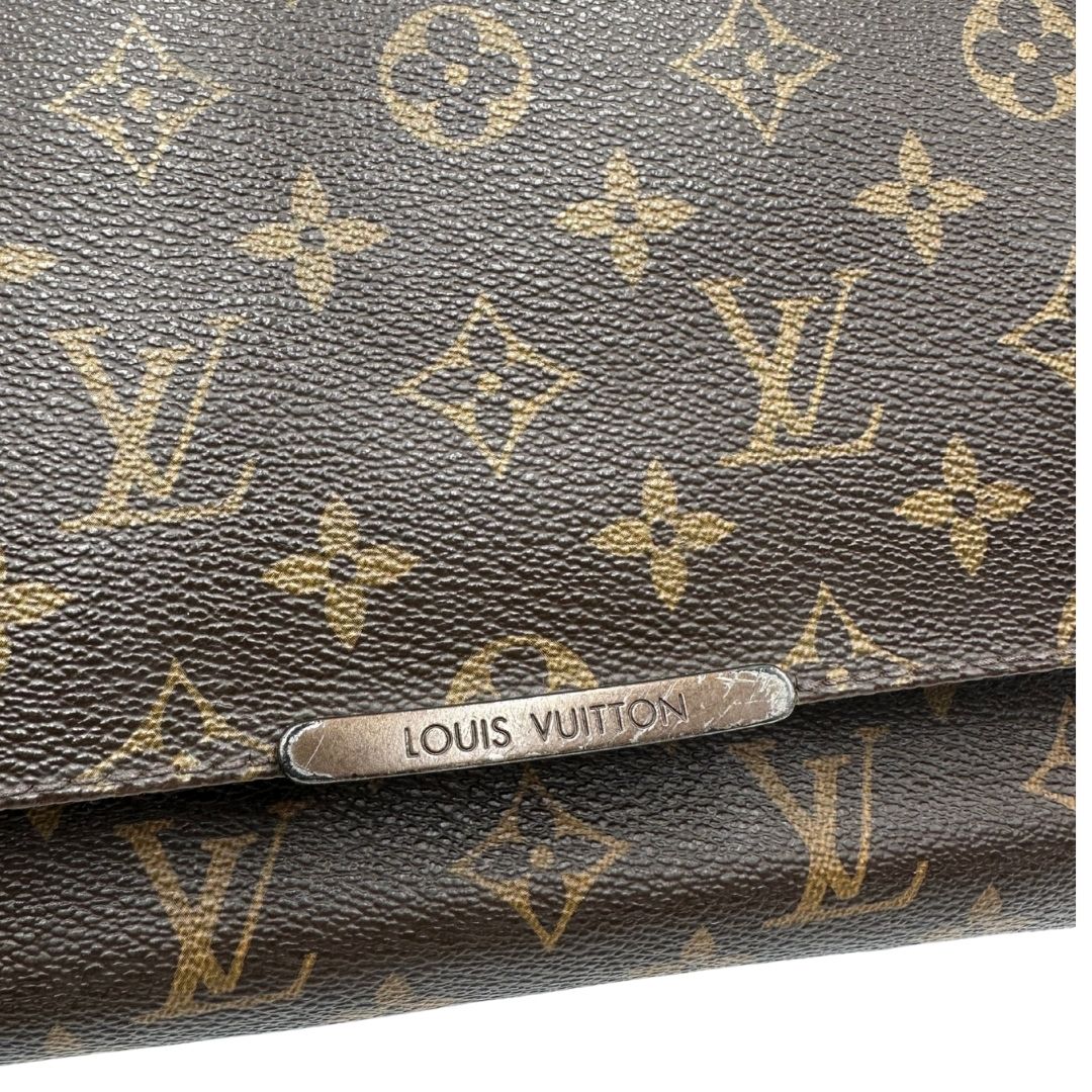 Cartella Louis Vuitton in canvas marrone monogram e parti metalliche dorate. Munita di una tracolla in tessuto regolabile, di lusso, originale, ottime condizioni, usata. 