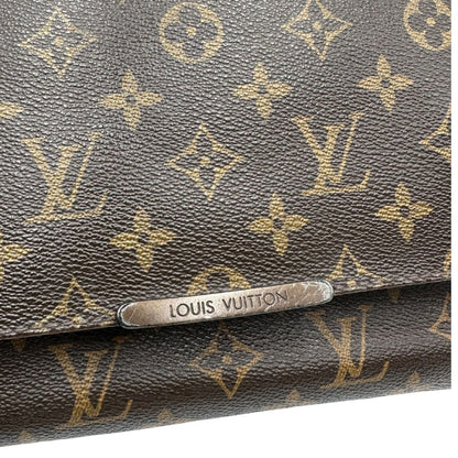 Cartella Louis Vuitton in canvas marrone monogram e parti metalliche dorate. Munita di una tracolla in tessuto regolabile, di lusso, originale, ottime condizioni, usata. 