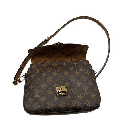 interno Borsa Louis Vuitton Métis in canvas marrone monogram reverse con parti metalliche dorate; munita di un manico singolo e una tracolla amovibile e regolabile. Completa di scatola, di lusso, originale, ottime condizioni, usata. 